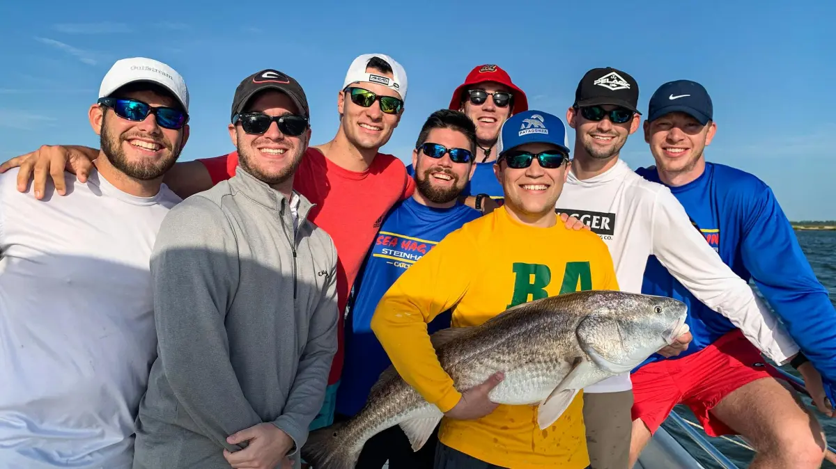 a man holding a fish